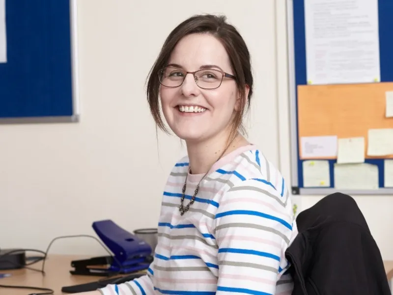 employee-sitting-at-desk-in-office