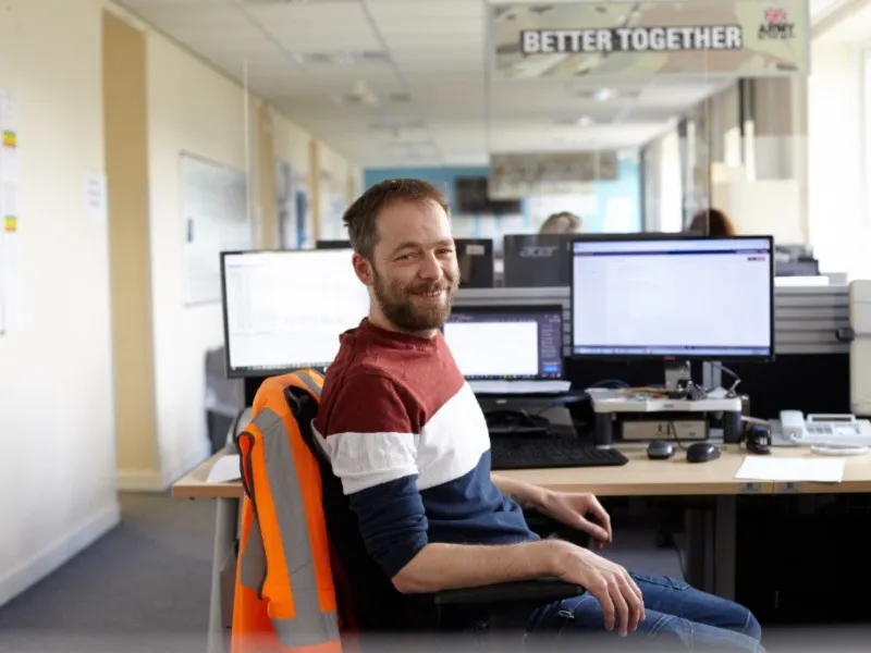 person sitting at office desk