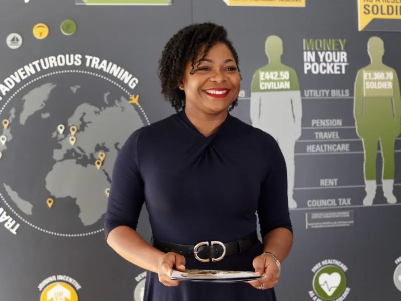 person standing near promotional poster